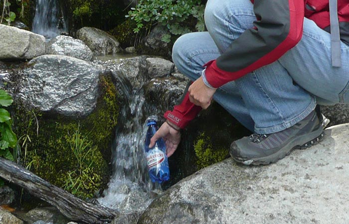 Filling water hiking camping © http://kiwiandcheese.com/el-calafate-and-hiking-in-torres-del-paine-national-park/